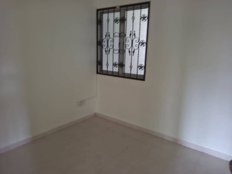 Bedroom with decorative window grille