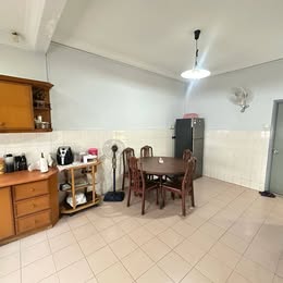 Dining area beside kitchen cabinets