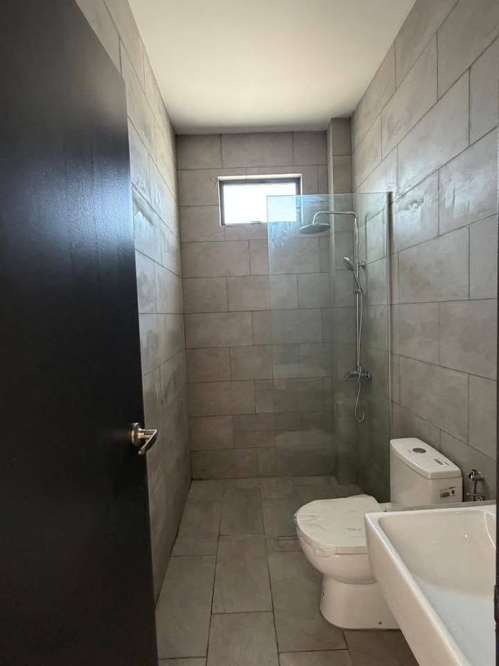 Tiled bathroom with glass shower screen