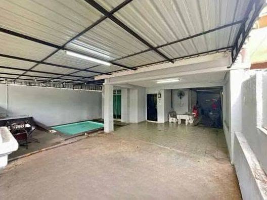 Fully covered car porch beside the pool